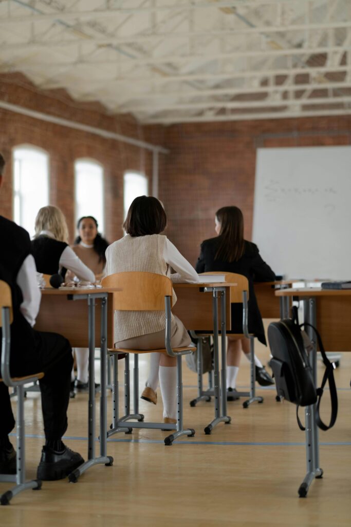 Students studying in a high school classroom. Diverse group focused on learning.